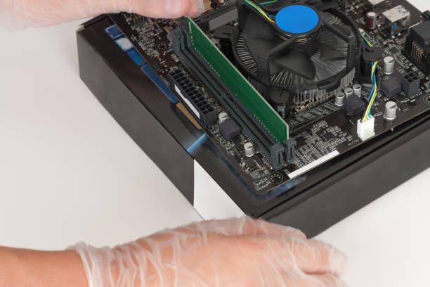 istock Close up of man hands installing Ram DDR4 memory 925917238