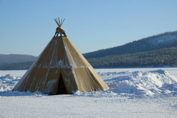 istock Winter polar landscape with eskimo tent. 925917640