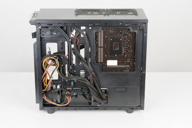 istock ATX motherboard inserted to black computer midi tower case. 925919402