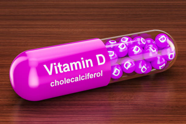 istock Vitamin D capsule on the wooden table. 3D rendering 925919994