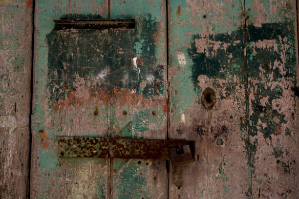 istock padlock on old wooden door 925926338