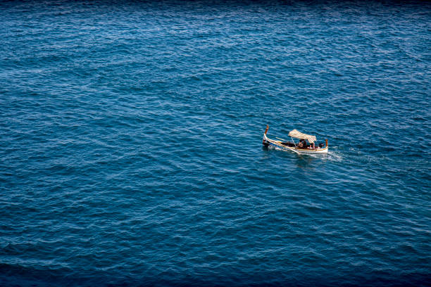istock old seaboat on the sea 925929388