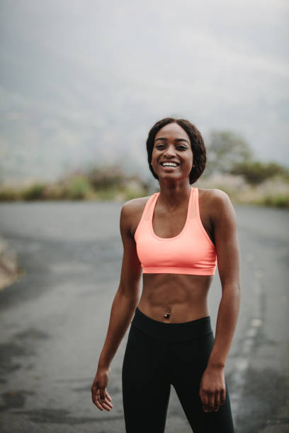 istock Young woman athlete on road 925936744