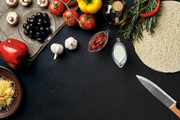 istock Pizza cooking ingredients. Dough, vegetables and spices. Top view with copy space 925938342