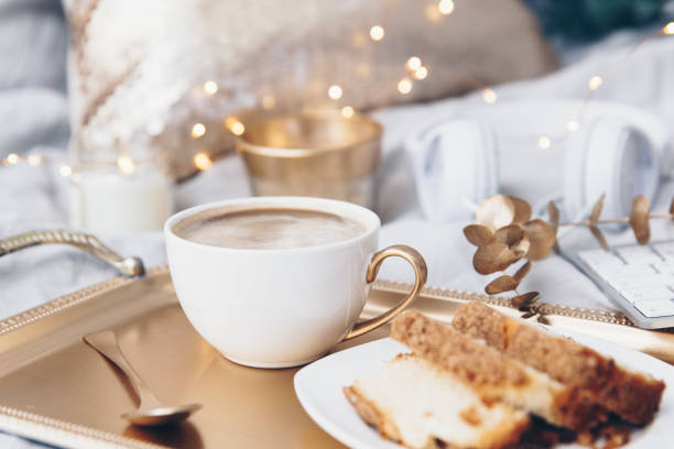 Coffee cup over cold tray. Trendy instagram image in gold tones