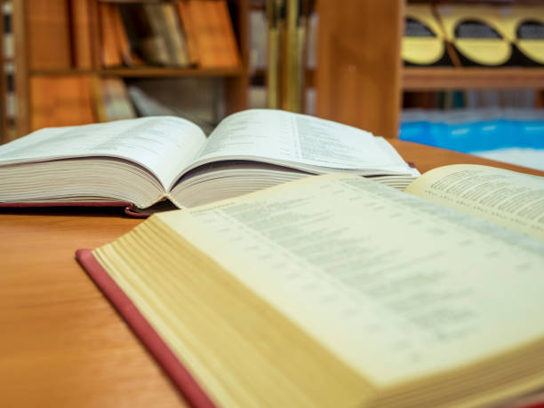 istock two opened books on the table reading in the university library 925943332