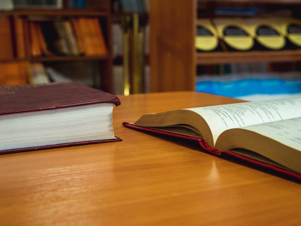 istock opened book on the table close up in the school 925943576
