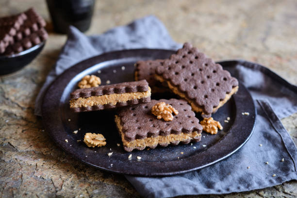 istock Cocoa sandwich biscuits stuffed with walnut and coffee filling 925944164