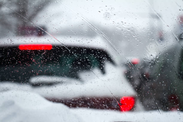 istock closeup of rain drops drizzle on car windshield 925952402