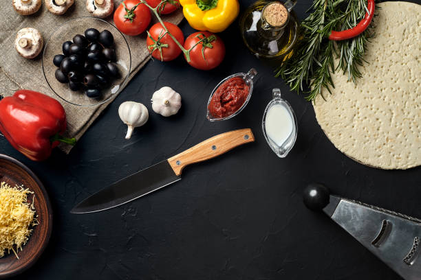 istock Pizza cooking ingredients. Dough, vegetables and spices. Top view with copy space 925952754
