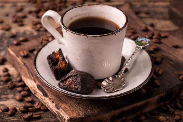 istock coffee cup with roasted  beans on wooden background 925963152