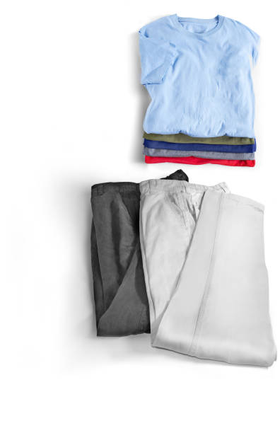 istock stacked t-shirts and pants with white space 925966564