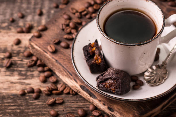 istock coffee cup with roasted  beans on wooden background 925970972