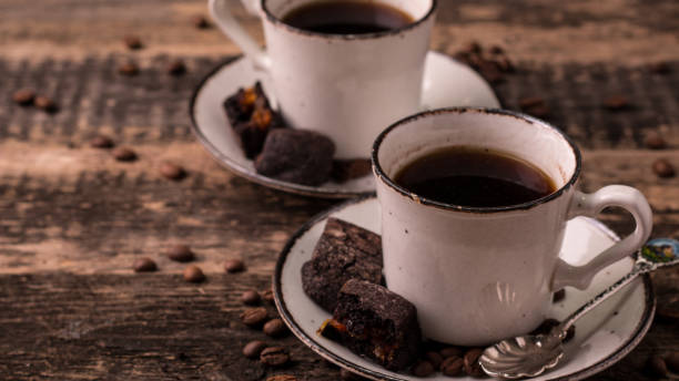 istock coffee cup with roasted  beans on wooden background 925974750
