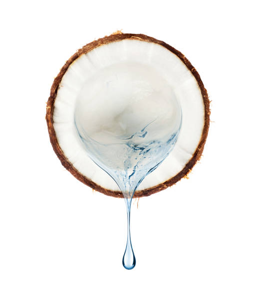 istock Juice flows from a slice of coconut on a white background 925977288