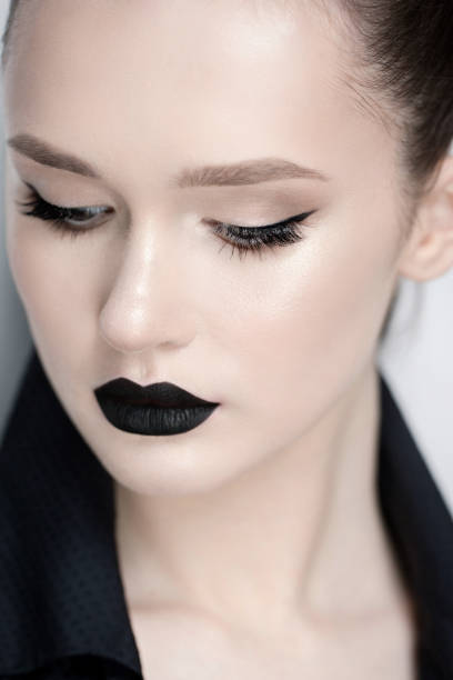 istock professional model with make up black lipstick eyeliner 925980226