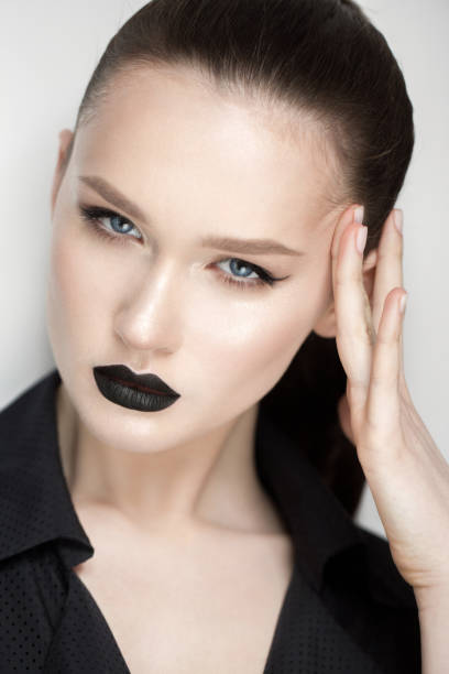 istock professional model with make up black lipstick eyeliner 925980236
