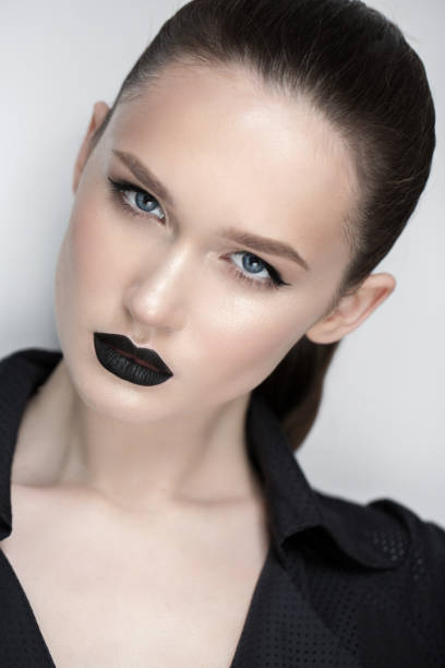 istock professional model with make up black lipstick eyeliner 925980388