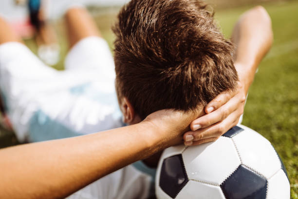 istock soccer player resting on the pitch 925984098