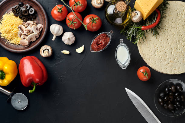 istock Pizza cooking ingredients. Dough, vegetables and spices. Top view with copy space 925984316