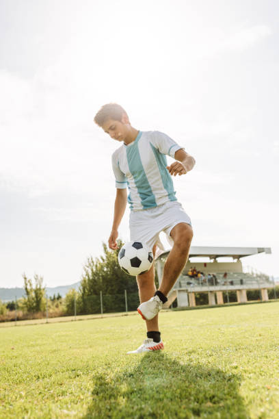 istock soccer player training on the field 925984448