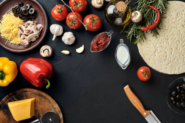 istock Pizza cooking ingredients. Dough, vegetables and spices. Top view with copy space 925984624