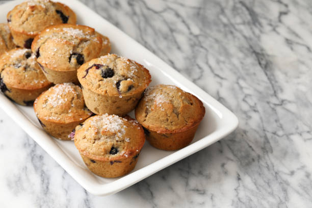 blood orange blueberry muffins - golden algae imagens e fotografias de stock