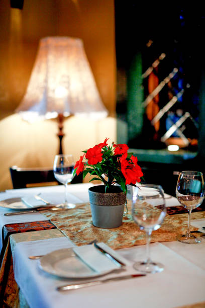 istock Seting table with glasses in restaurant and antique lamp beside 926000752
