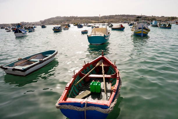 istock Many multi-colored boats stand in marina 926000792