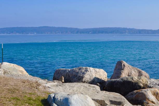istock Lake Michigan Shoreline with Rocks and Blue Sky 926005178