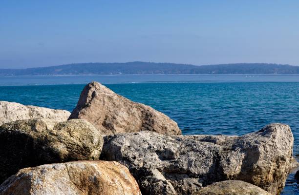 istock Lake Michigan Shoreline with Rocks and Blue Sky 926005184