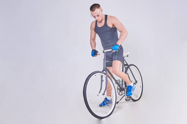 istock A handsome sports man sits on a Bicycle 926007786