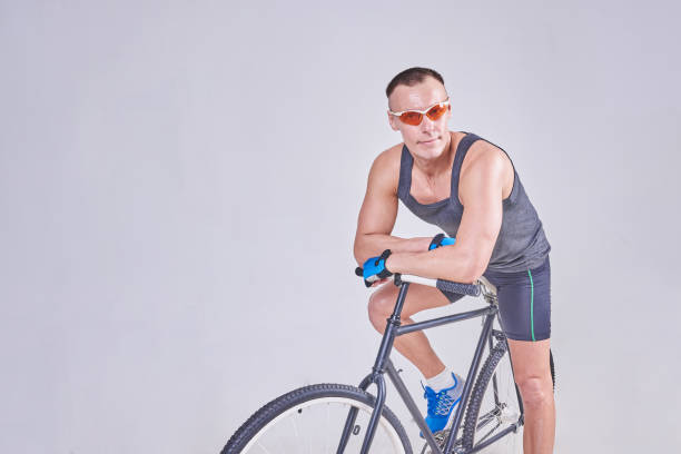 istock A handsome sports man sits on a Bicycle 926007888