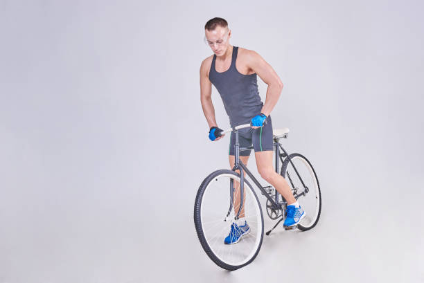 istock A handsome sports man sits on a Bicycle 926008178