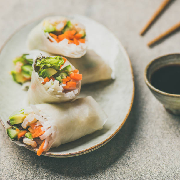 istock Shrimp and vegetable rice paper rolls, grey background, square crop 926010276