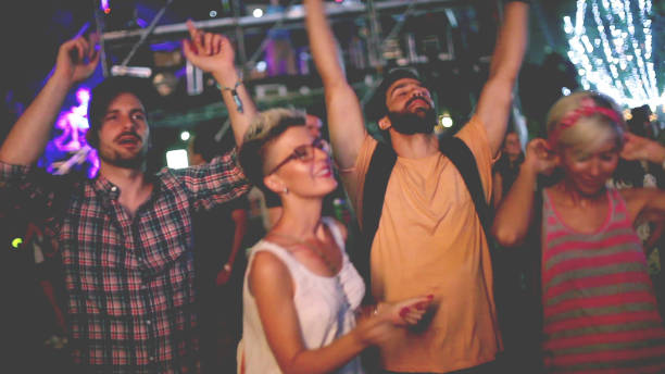 istock Four hipster people dancing  at the concert 926010480