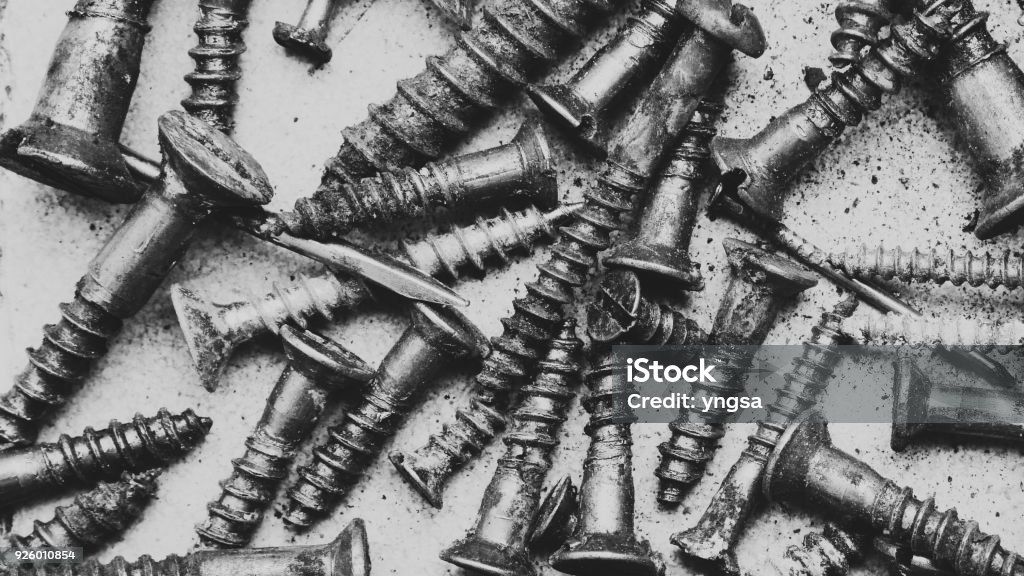 rusty screws pattern. old steel bolts - macro top view. vintage repair tools Bolt - Fastener Stock Photo