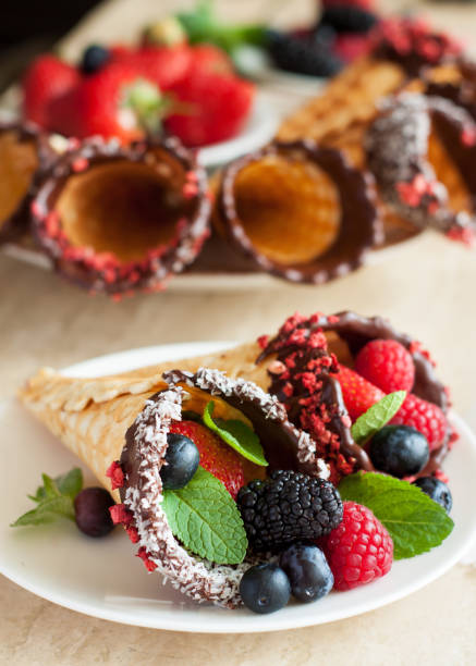 istock Dark Chocolate-Dipped Waffle Cones with berries 926010860