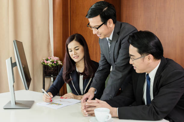 istock successful business ideas concept happy asian business teamwork is completed task and triumphing with raised hands with laugh and smile emotion 926010982