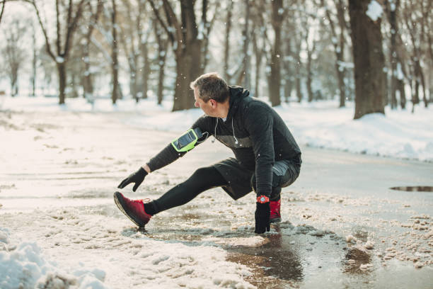 istock Senior man stretching before jogging in park 926011022