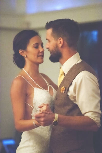 Summer modern wedding series Brunette Bride and Groom Celebration Summer modern wedding series Brunette Bride Outdoor Celebration young couple with children outdoor wedding events including communion and dancing - grain added where needed for effect on indoor set (photos professionally retouched - Lightroom / Photoshop - original size 5616 x 3744) bride hugging father on wedding day stock pictures, royalty-free photos & images