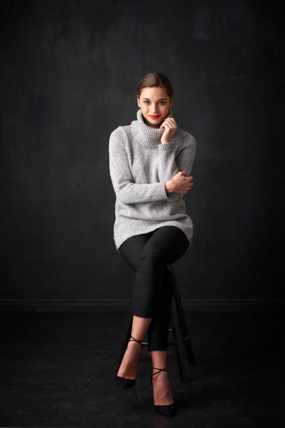 istock Relaxed young woman at dark background 926016686