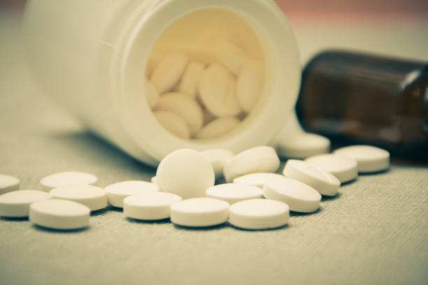 istock Pills. Illness, sadness. The tablets fell from the jar. 926022672