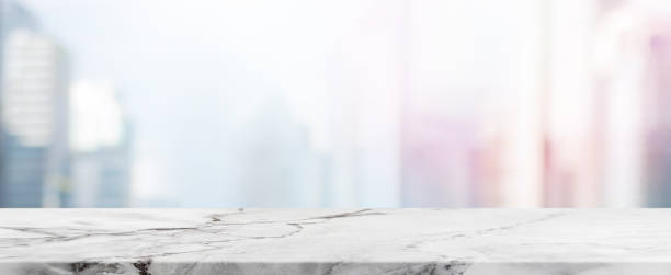 istock Empty White Stone table top and blur glass window wall building banner mock up background - can used for display or montage your products. 926023294