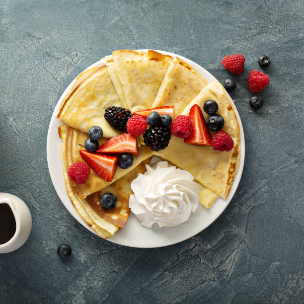 istock Thin crepes with whipped cream and berries 926025460