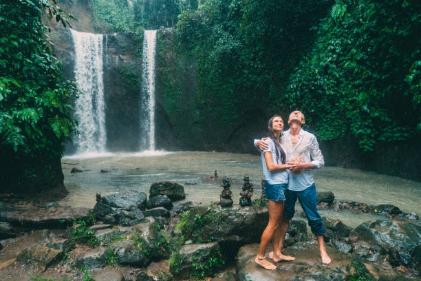 istock Mature couple standing near waterfall 926025594