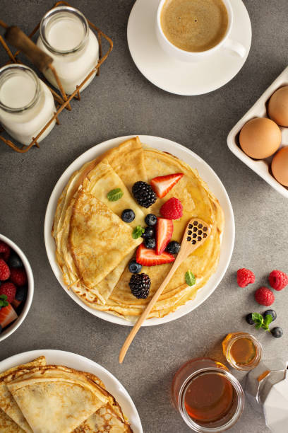 istock Thin crepes with berries and honey 926030150
