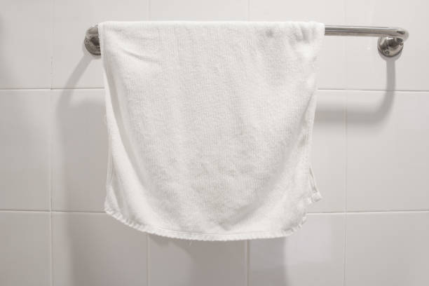 istock white towel hang on stainless steel in bathroom 926030314