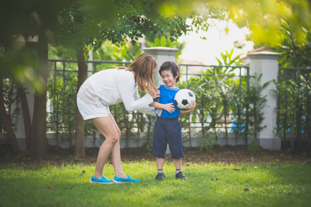 istock Asian mother and son Playing Soccer 926034000