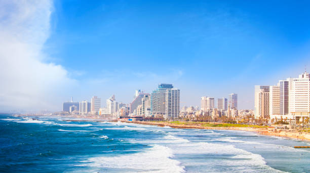 Tel Aviv coastline,  Israel View of Tel Aviv beach at and cityscape on a sunny day. tel aviv photos stock pictures, royalty-free photos & images